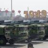 Military vehicles carry an earlier version of China’s hypersonic missile during a 2019 parade