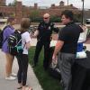 Folks take a break and have popsicles with cops.