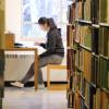 student studying in library