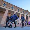Campus community members walking past Norlin Library