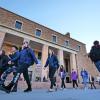 campus community members walking outside of Norlin Library