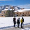 Campus community members walking on a snowy campus