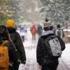 Campus community members walking on a snowy campus