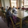 Students sit in a small class discussion