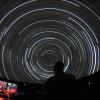 Person works controls at Fiske Planetarium's immersive theater