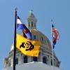 Flags atop the state capitol. (Photo by Casey A. Cass/University of Colorado)