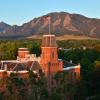 Old Main on CU Boulder campus and Flatirons at sunset