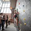 campus community members climbing the rock wall at the Rec