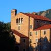 Building on campus with Flatirons in the background