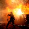 a firefighter extinguishing a blaze in California