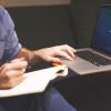 Man logs into laptop to change grade