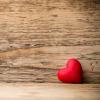 red painted heart with rustic wood background