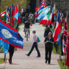 A CU Boulder campus sidewalk with world flags on either side of it