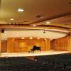 Piano on stage in an empty Grusin Music Hall