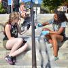Two students re-painting handrails on The Hill