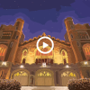 illustration of Macky Auditorium on a starry night with a video play button overlay