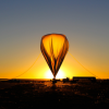 Sunrise illuminates hot air balloon