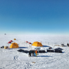 Group of researchers and tents on ice in Greenland