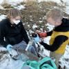 Researchers conduct water sampling.