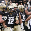 Quarterback Steven Montez and teammates celebrate a CU score last October. (Roger Carry)