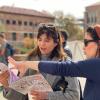 graduate students flip through a children's book