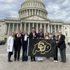 Chancellor Philip DiStefano, Professor Stefanie Johnson and student leaders in front of the capitol building