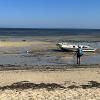 Two researchers on a beach in Madagascar
