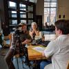 Andrew McGraw interviews Micah Salazar in the lobby of the ATLAS building