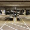Car at EV charging station in parking garage