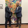  Daryl Maeda and artist DaMontá Madden in front of a painting.