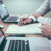 Men collaborate on work