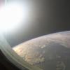 Sun sets over Earth as seen from a window on the International Space Station.