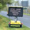 A sign that says stay home