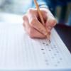 student filling a scantron test
