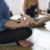 Group of people participating in a yoga class