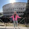 Student in front of the Colosseum in Rome, Italy