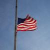 American flag flying half mast