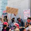 People holding stop asian hate signs at a protest in San Francisco