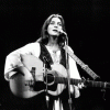 Former CU employee Judy Collins plays guitar, sings on stage