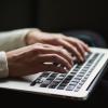 Person typing on computer