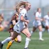Kayleigh Webb runs with soccer ball
