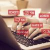 person typing hateful things on keyboard