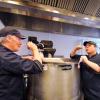 Kerry Patterson, executive chef, taste-tests chili with executive sous chef Christian Black in the C4C