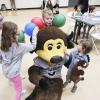 Kids have fun with Chip and balloons at Campus Kids Day