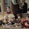 A photo showing several actors in the movie 'Killers of the Flower Moon'. The actors are portraying Indigenous women of the Osage Nation in the 1920s.