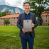 Tony Kong poses with his award