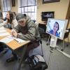 Student participates in classroom remotely using Kubi technology