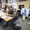 Anne Miller, a CU Boulder International Affairs major, uses new OIT technology called "Kubi" (Japanese word for neck) to attend an Arabic language class face-to-face while recovering from an injury.
