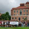 Students gather for a photo, holding a class of 2027 sign.