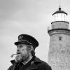 Black and white photo of Willem Dafoe and Robert Pattinson in The Lighthouse film